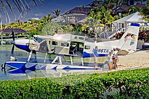 Boater photographing Sea Plane at Abaco Inn, Elbo Cay Abaco, Bahamas