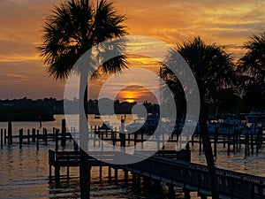 Boaters enjoy a lazy sunset as they cruise the Anclote River. Tarpon Springs, Florida Sunset