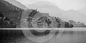 Boaters on the Phewa Lake, with the foothills of the Annapurna mountain range