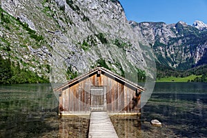 Boathouse in alpine mountain lake scenery