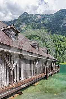 Boathouse German Konigssee with steep mountains and clear transparant water