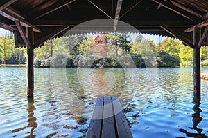 Boathouse with jetty in the lake of Het Loo park