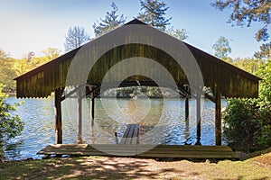 Boathouse with jetty in the lake of Het Loo park
