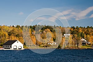 Boathouse on lake in fall