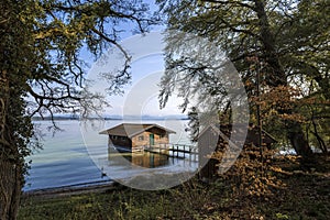 Boathouse of lake of Starnberg, Bavarian mountains in Germany