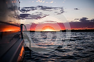 Boating on the peaceful lake at sunset