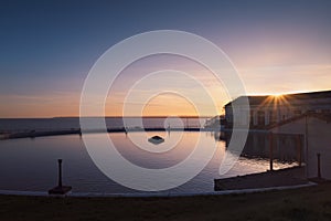 The boating pool in Ramsgate, Kent, UK at sunset with Sandwich Bay in the background
