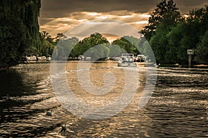 Boating on the river Thames at sunset