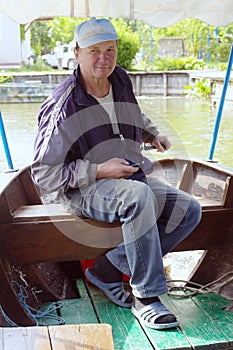 Boatman in a pleasure boat, on the Danube River, Vilkovo, Ukraine