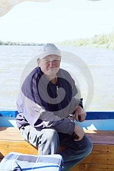 Boatman in a pleasure boat, on the Danube River, Vilkovo, Ukraine