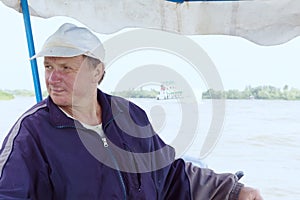 Boatman in a pleasure boat, on the Danube River, Vilkovo, Ukraine