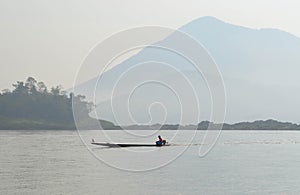 Boatman Sailing Motorboat In The River