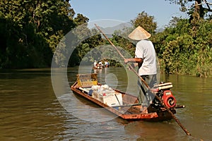 Boatman sell`s food in the river photo