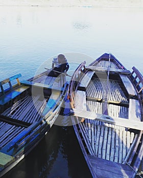 Boatman sit on his boat | Boat in river bank