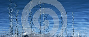 Boats abstract reflexion over blue water photo