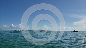 Boats at anchor on sunny summer day off Elliott Key, Florida 4K.