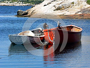 Boats anchored at bay over blue water