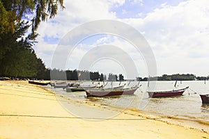 Boats anchored by the beach