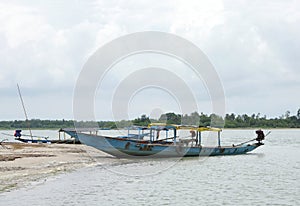 Boats anchored at crab island, chilka lake, Orissa photo