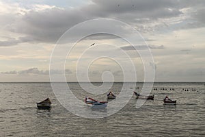 Boats anchored off the coast of Rio Caribe photo