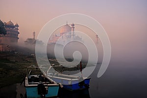 Boats anchored on Yamuna River near Taj Mahal in early morning, Agra, Uttar Pradesh, India