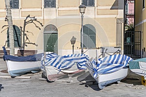 Boats ashore in street, Bonassola, Italy