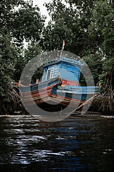 Blue Boat on the banks of the Zaire River on the border between Angola and the Democratic Republic of Congo photo