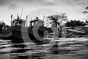 Boats on the banks of the Zaire River on the border between Angola and the Democratic Republic of Congo photo