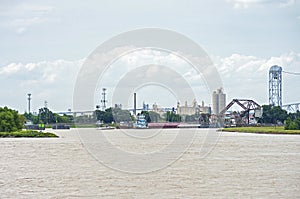 Boats and barges at industrial canal lock in new orleans