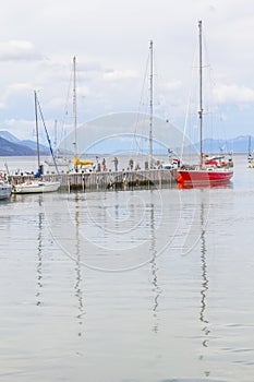 Boats in Beagle channel with mountains in Ushuaia