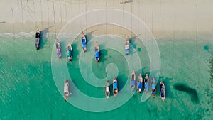 Boats in beautiful bay at beach at the tropical island. Thailand. Asia. Phi Phi. Top-down perspective