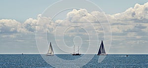 Boats in the blue sea, cloudy sky