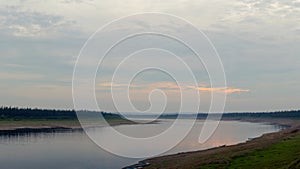 Boats and boats occasionally stand on the banks of the Northern river Viluy