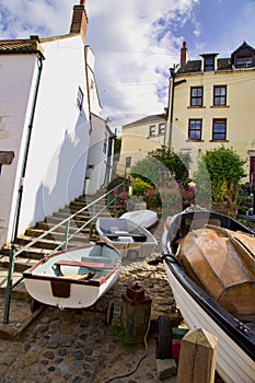 Boats at the bottom of steps in Robin Hoos's Bay England