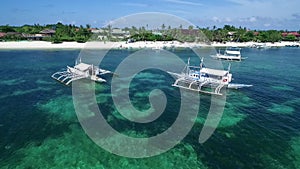 Boats in Bounty Beach and Malapascua Island Seashore in Cebu, Philippines. Sulu Sea and Beautiful Seascape in Background II