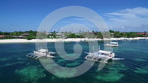 Boats in Bounty Beach and Malapascua Island Seashore in Cebu, Philippines. Sulu Sea and Beautiful Seascape in Background III