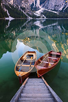 Boats on the Braies Lake Pragser Wildsee in Dolomites mounta