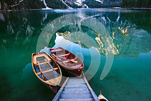 Boats on the Braies Lake Pragser Wildsee in Dolomites mounta