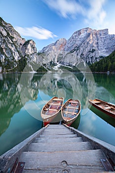 Boats on the Braies Lake Pragser Wildsee in Dolomites mounta