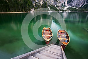 Boats on the Braies Lake Pragser Wildsee in Dolomites mounta