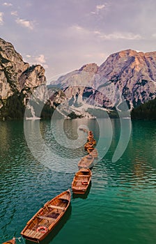 Boats on the Braies Lake Pragser Wildsee in Dolomites mountains, Sudtirol, Italy. Alps nature