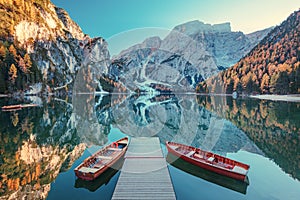 Boats on the Braies Lake  Pragser Wildsee  in Dolomites mountains, Sudtirol, Italy. Alps nature landscape