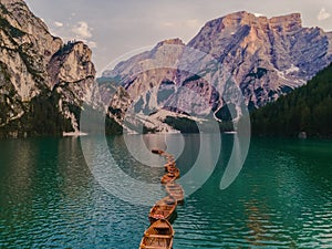 Boats on the Braies Lake Pragser Wildsee in Dolomites mountains, Sudtirol, Italy. Alps nature