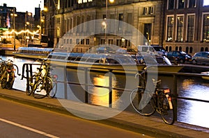 Boats canal bicycles night amsterdam holland