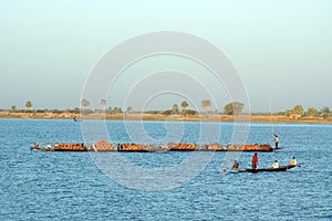 Boats carrying goods across river in Africa