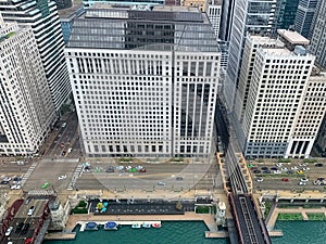 Boats and cars line up on the Chicago River and Wacker Drive in Chicago Loop