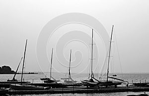 Boats on city lake shore