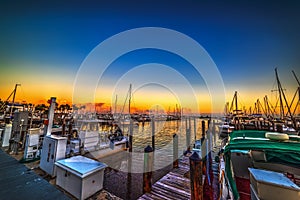 Boats in Coconut Grove harbor at sunset