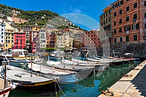 Boats and colorful houses of Camogli, Italy.