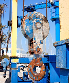 Boats crane hook pulley detail on marina